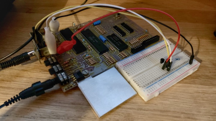 A ZX81 PCB attached to a breadboard circuit via crocodile clips