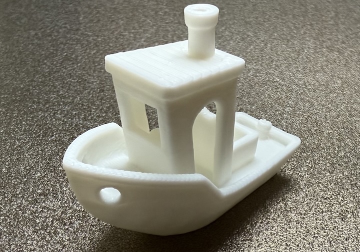 A white, 3D printed tugboat